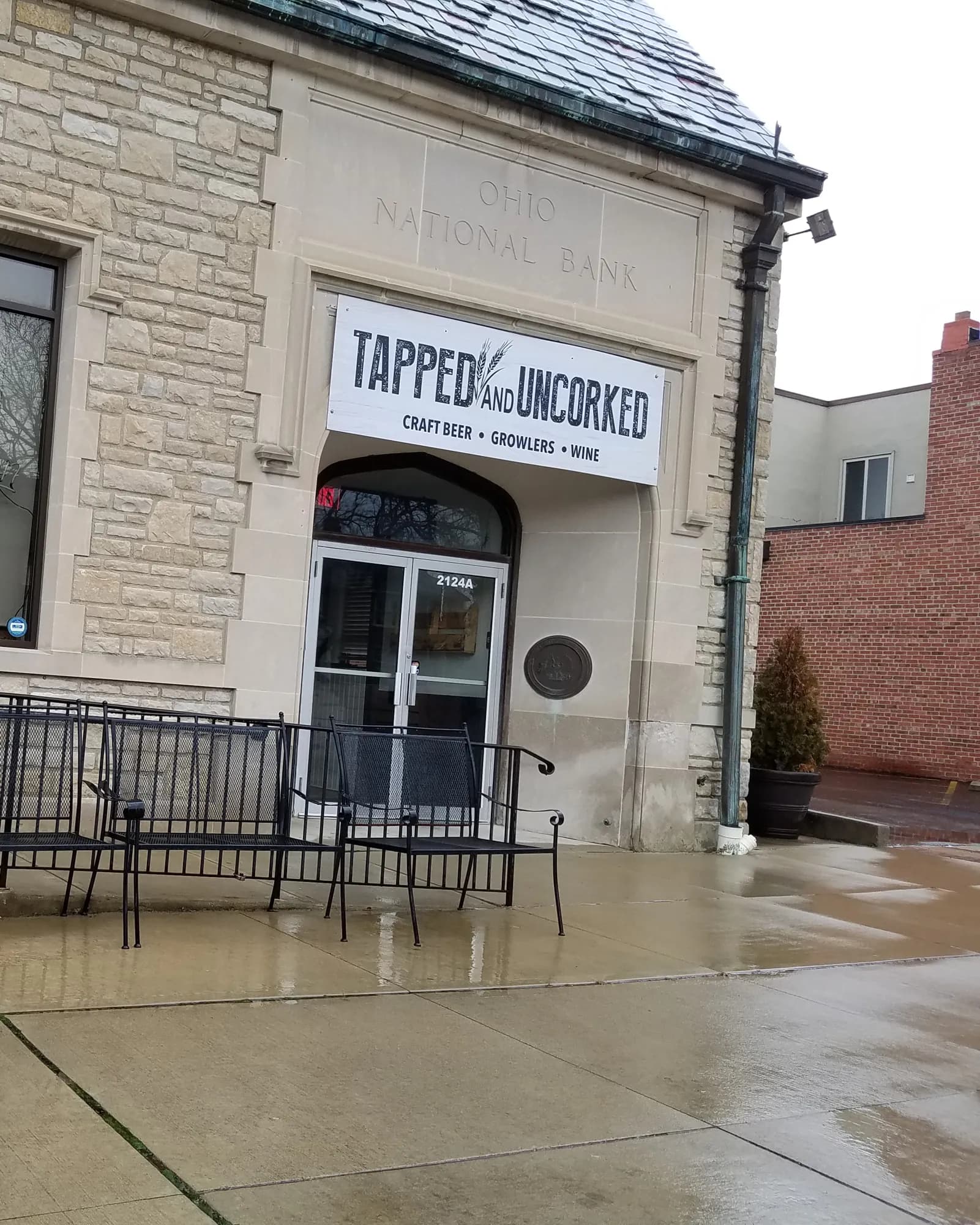 A limestone storefront in Upper Arlington with patio seating out front