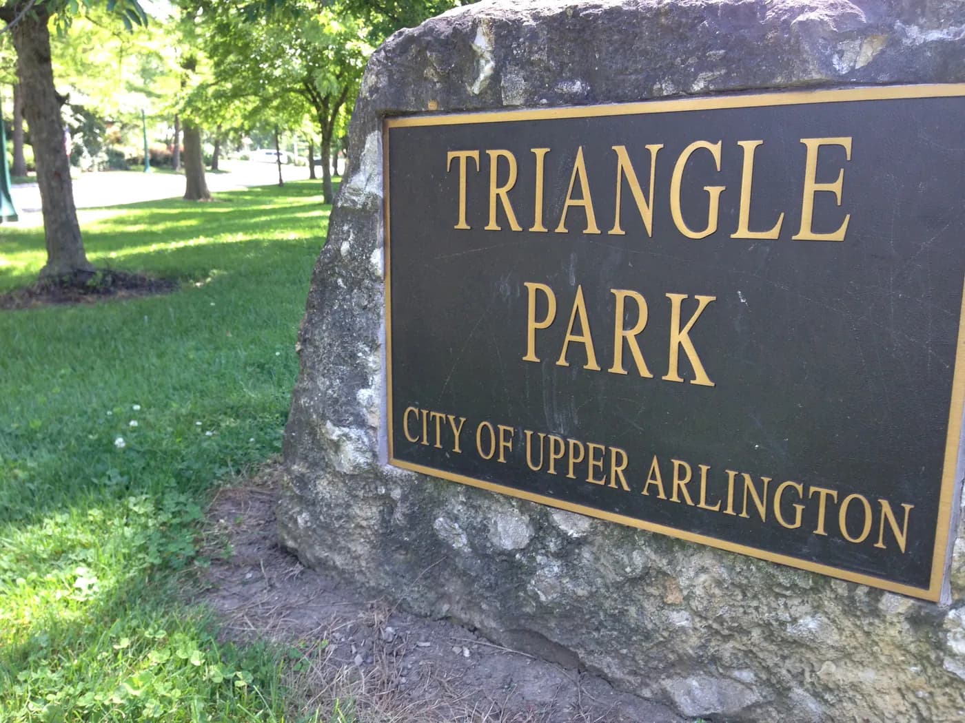 The Triangle Park sign, City of Upper Arlington, set in a stone boulder